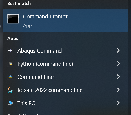 The Abaqus Command prompt window open on a Windows desktop, showing the working directory path, the Abaqus version banner, and a blinking cursor ready for command input, with common environment variables listed.